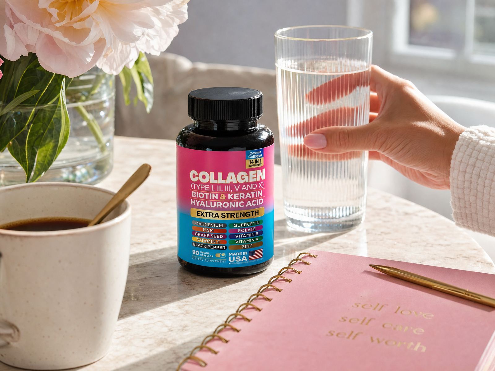 A hand reaching for a glass of water beside the collagen bottle, flowers and coffee on a marble counter