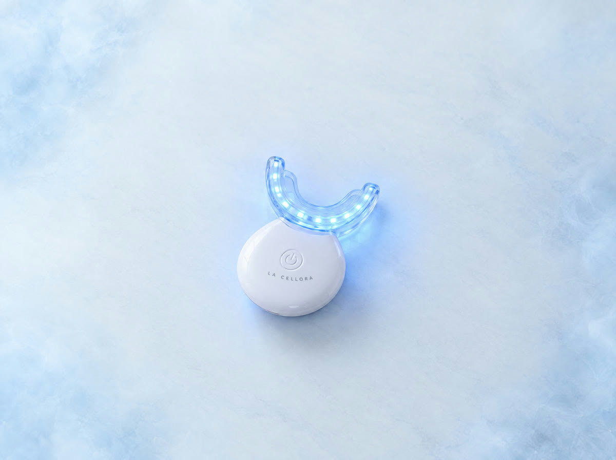 The white La Cellora LED light glowing blue